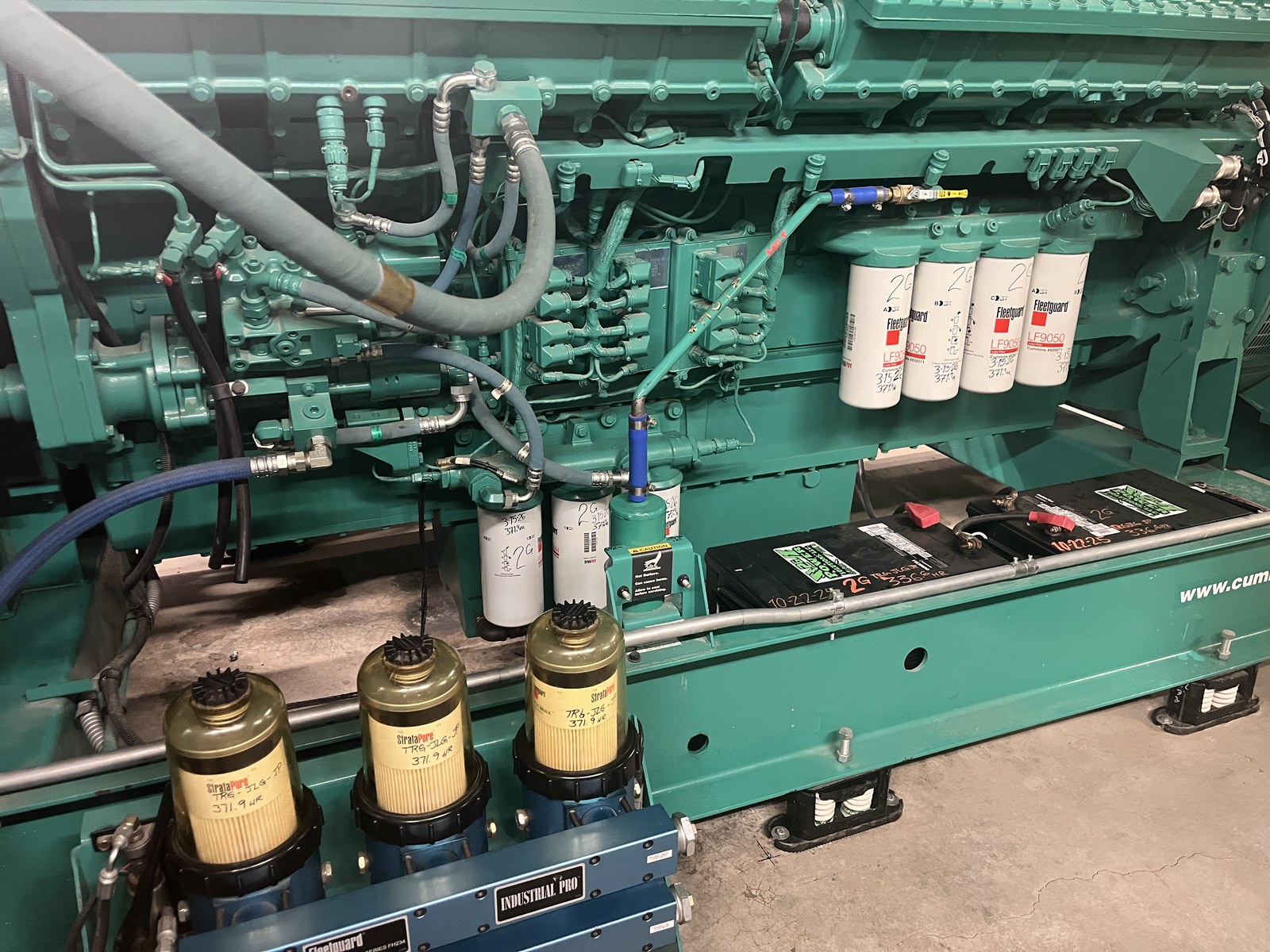 A commercial diesel generator engine being serviced by 2G Power Solutions during planned maintenance