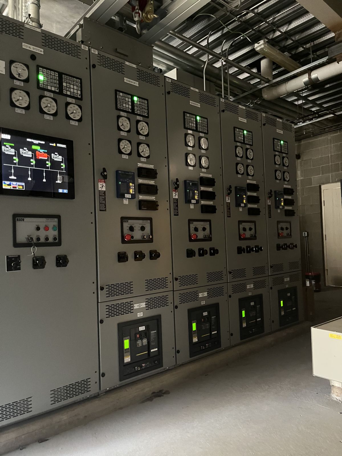 Commercial switchgear lineup with metering, a mimic control display, and breaker cells serviced by 2G Power Solutions